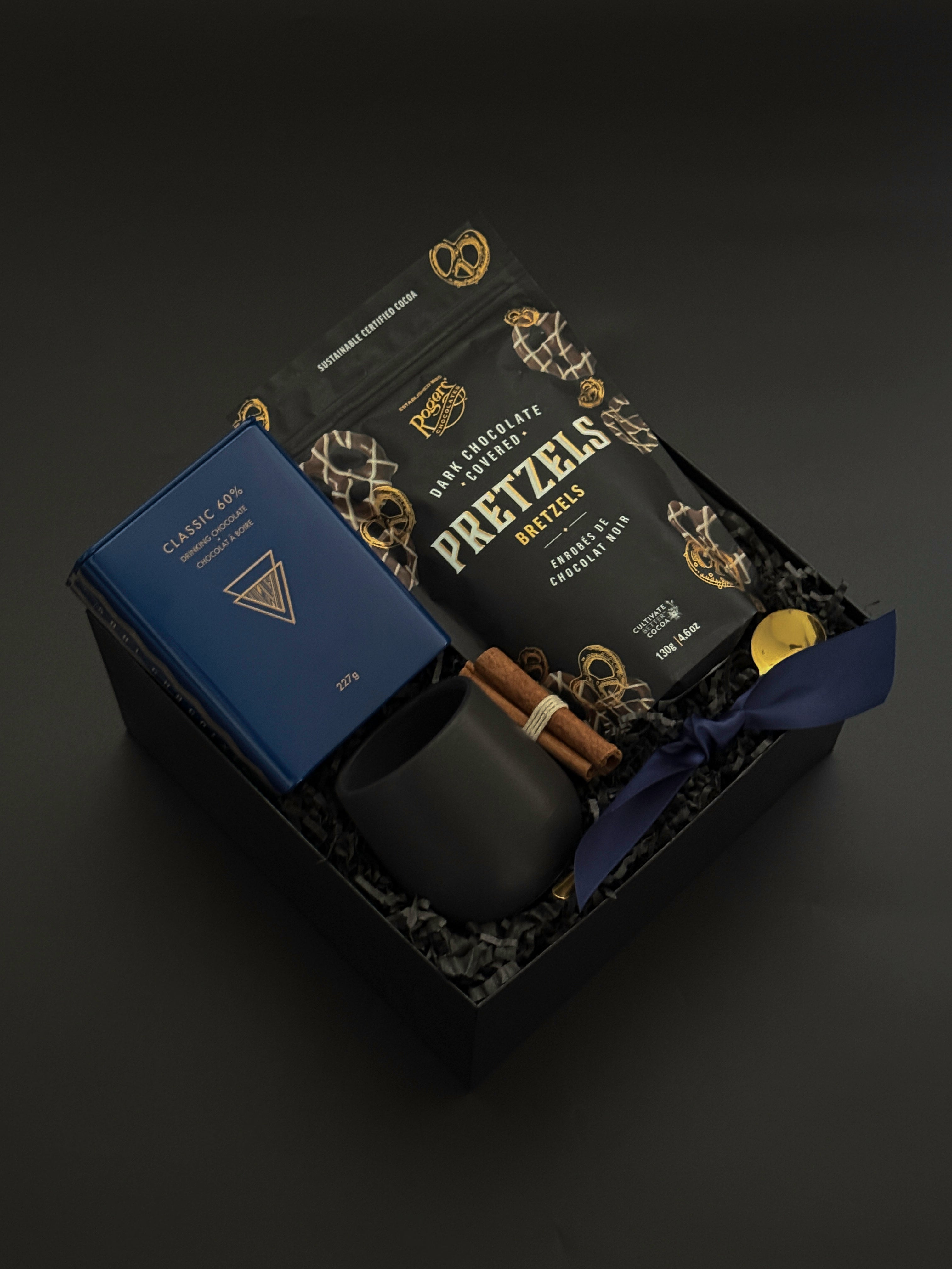 Luxury holiday gift boxes elegantly wrapped with grosgrain ribbon and artisan Canadian products | Muse Baskets and Co.