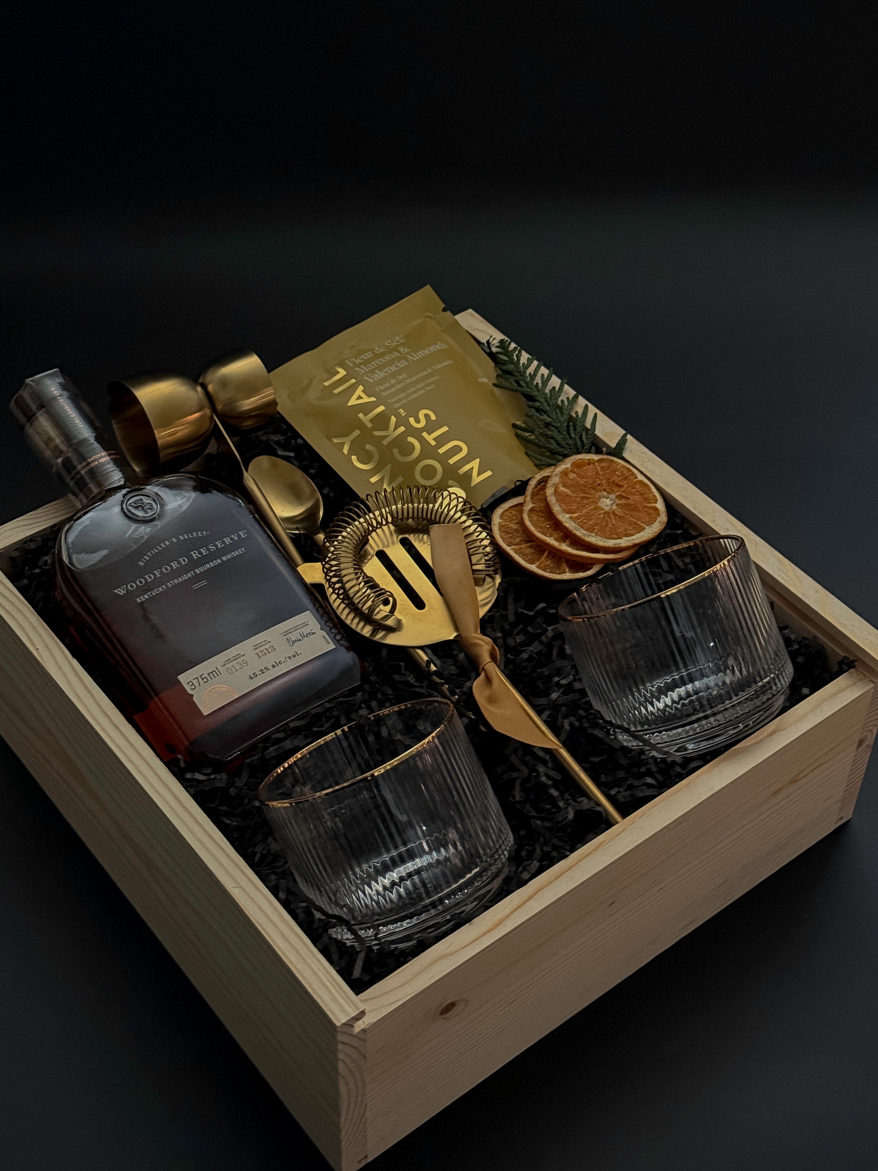 Elevated client appreciation gift box with bourbon, artisan pairings, and barware.