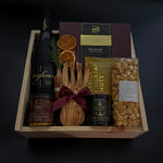 Elevated client appreciation gift box with cava, Canadian gourmet treats, and festive details.