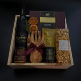 Elevated client appreciation gift box with cava, Canadian gourmet treats, and festive details.