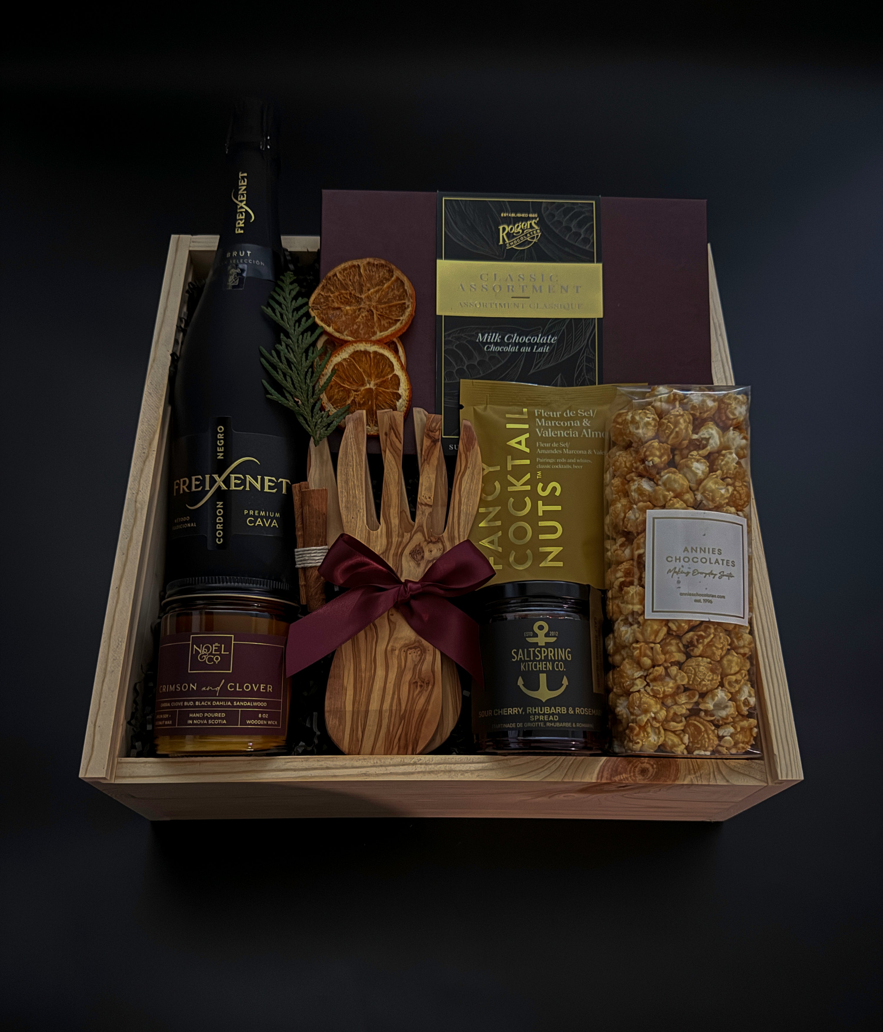 Elevated client appreciation gift box with cava, Canadian gourmet treats, and festive details.