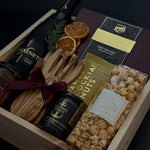 Curated Canadian artisan holiday gift box with preserves, almonds, and candle.