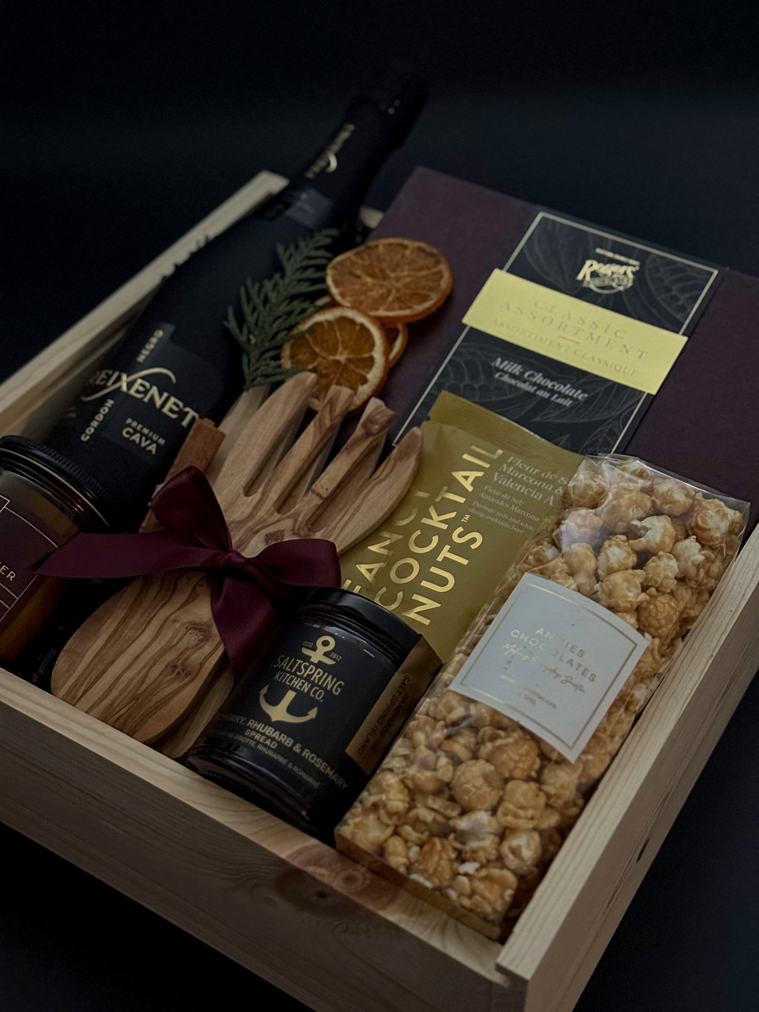 Curated Canadian artisan holiday gift box with preserves, almonds, and candle.
