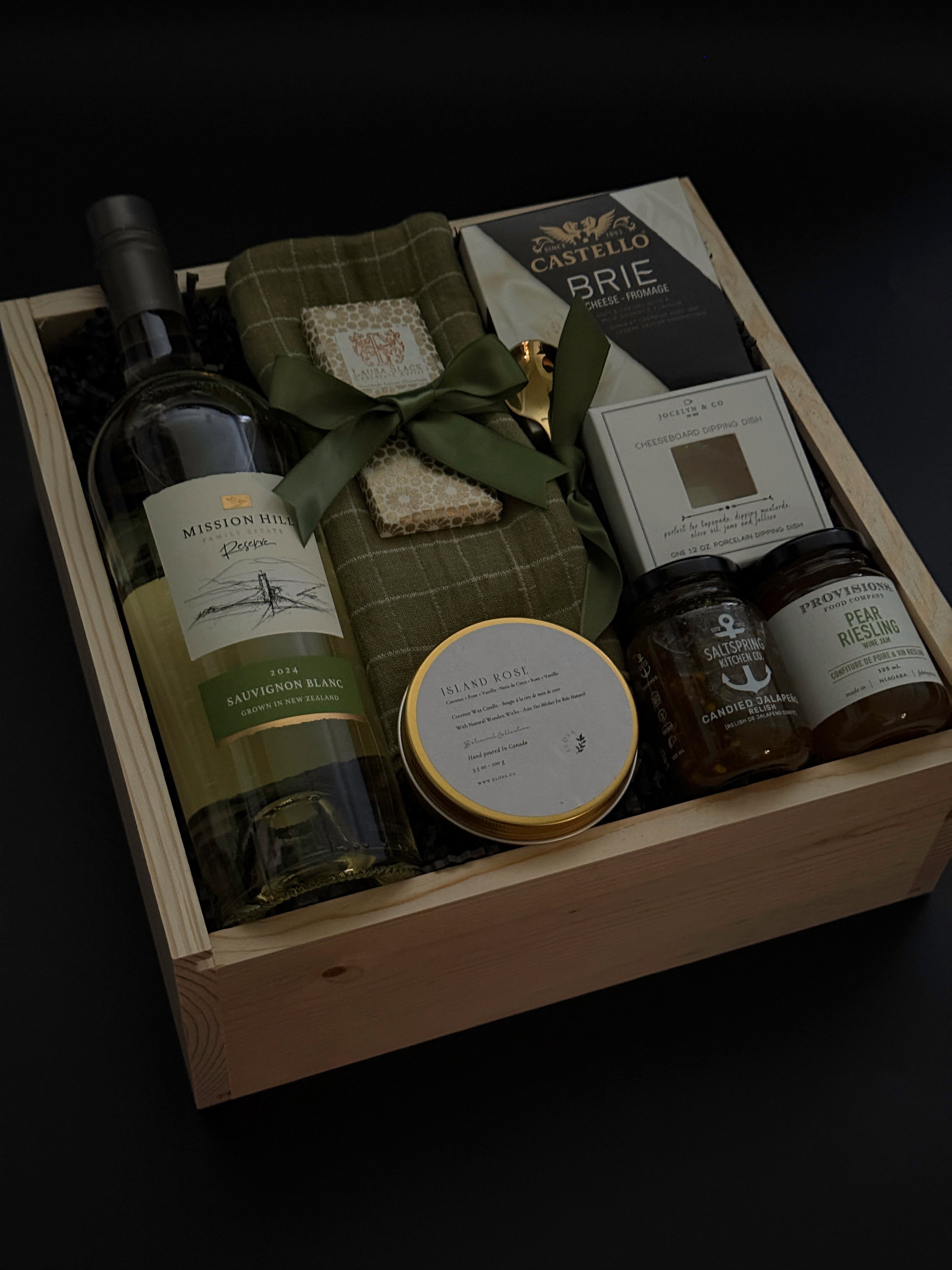 Luxury corporate client gift box featuring wine, Brie, jam, dipping dish, candle, and chocolate in a wood box,  ideal for realtors, law firms, and design studios.
