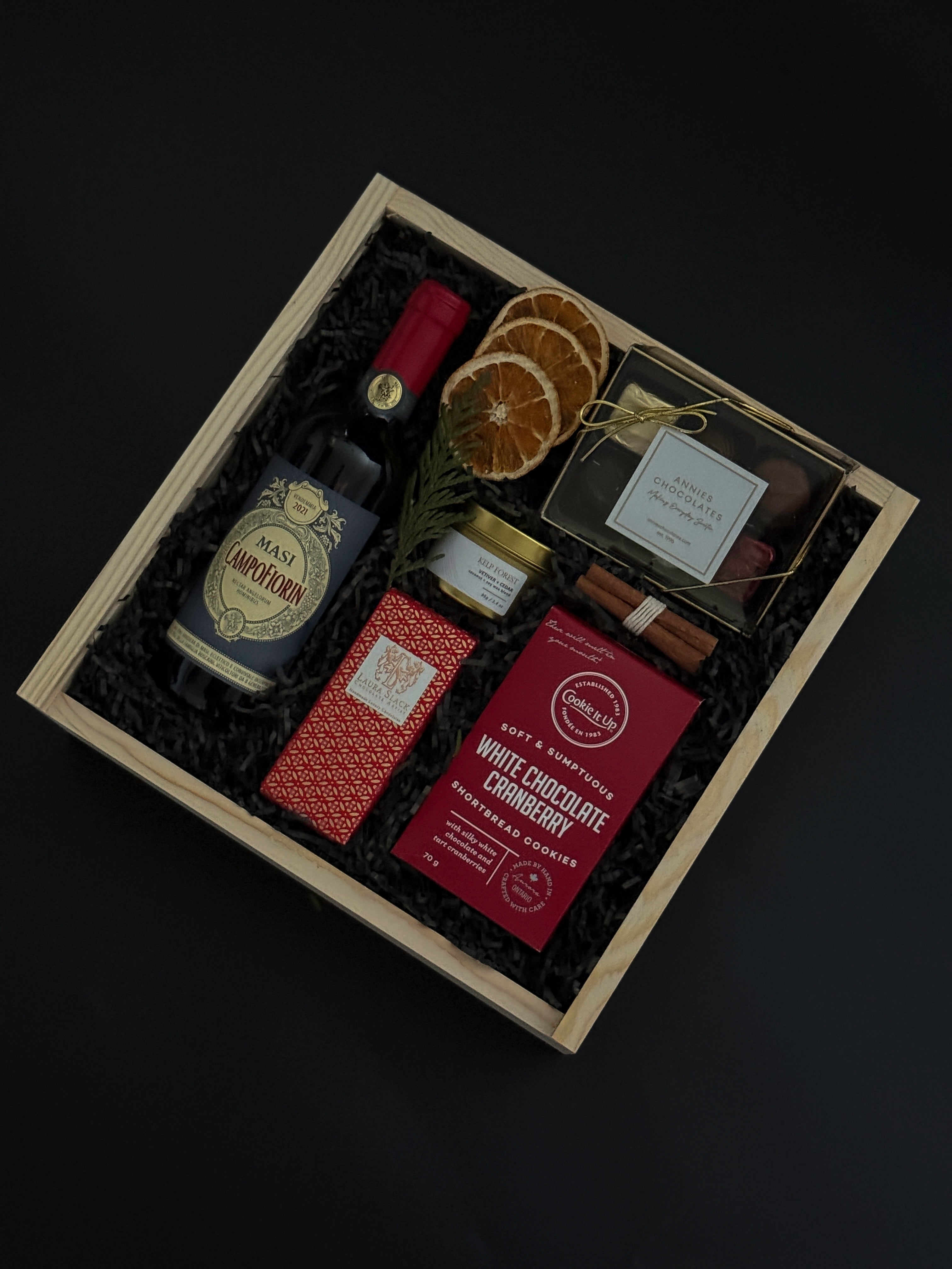 Dolce Notte holiday gift box with Masi Campofiorin red wine, chocolates, and festive accents.