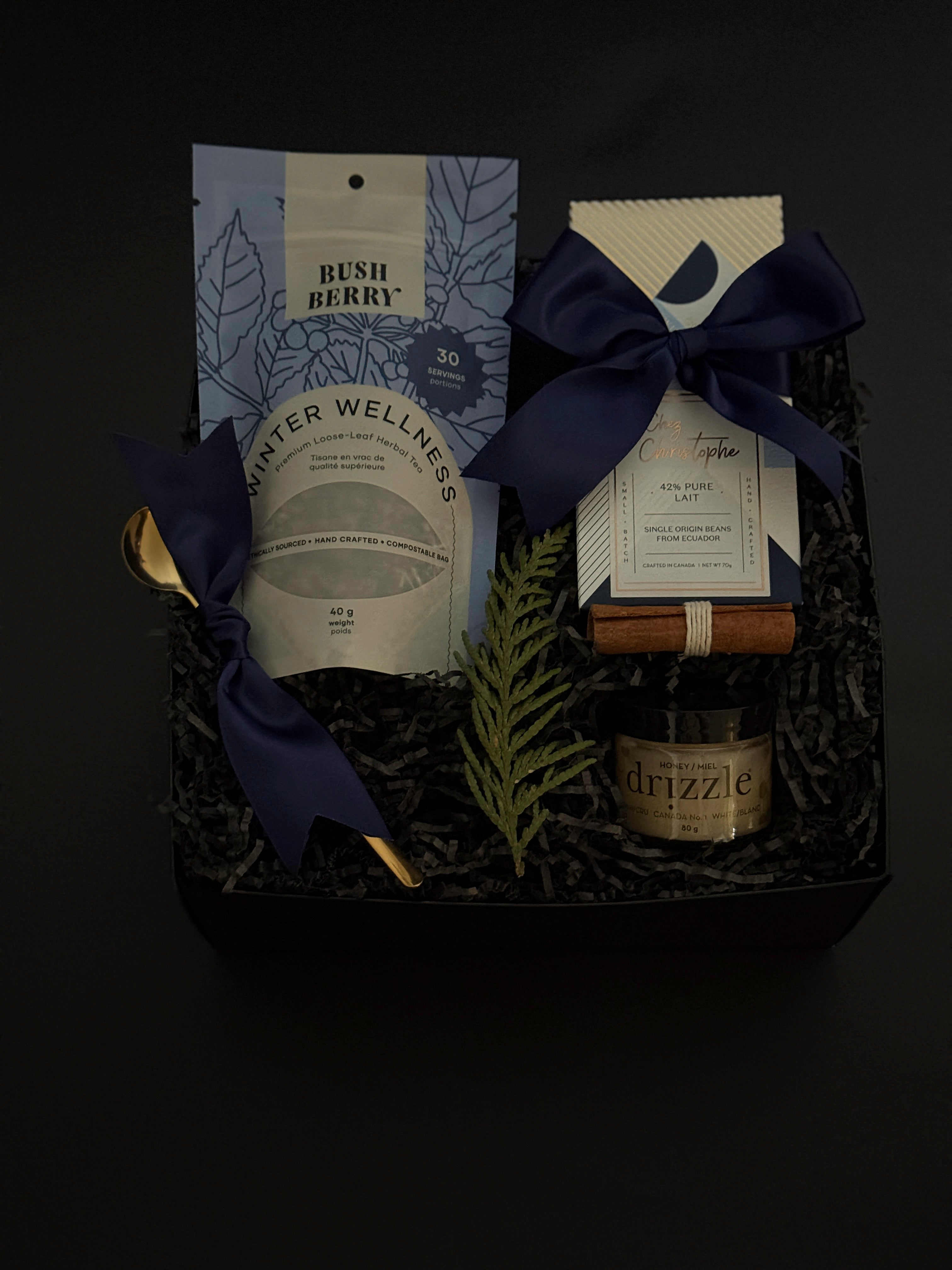 Sanctuary in Winter gift box with optional stoneware mug, artisan treats, and holiday accents in signature black packaging.