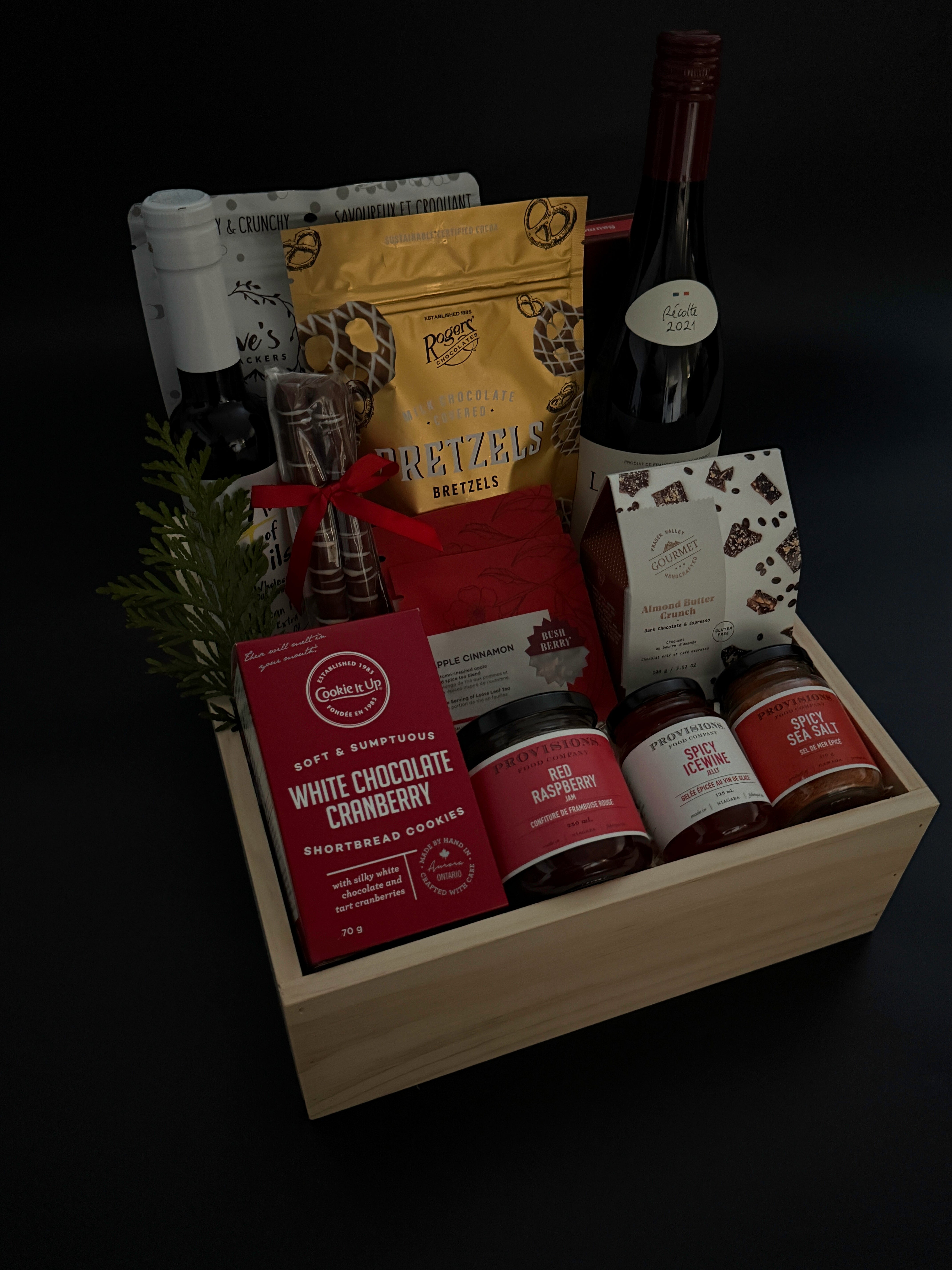 Elegant wood box gift with wine, preserves, salmon, and artisan chocolates.
