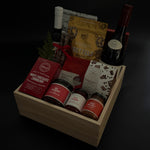 Holiday gourmet gift with wine, shortbread cookies, and Canadian artisan delicacies.