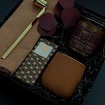 Corporate holiday gift box featuring candle, Japanese Chiyogami chocolate, and gold candle snuffer.