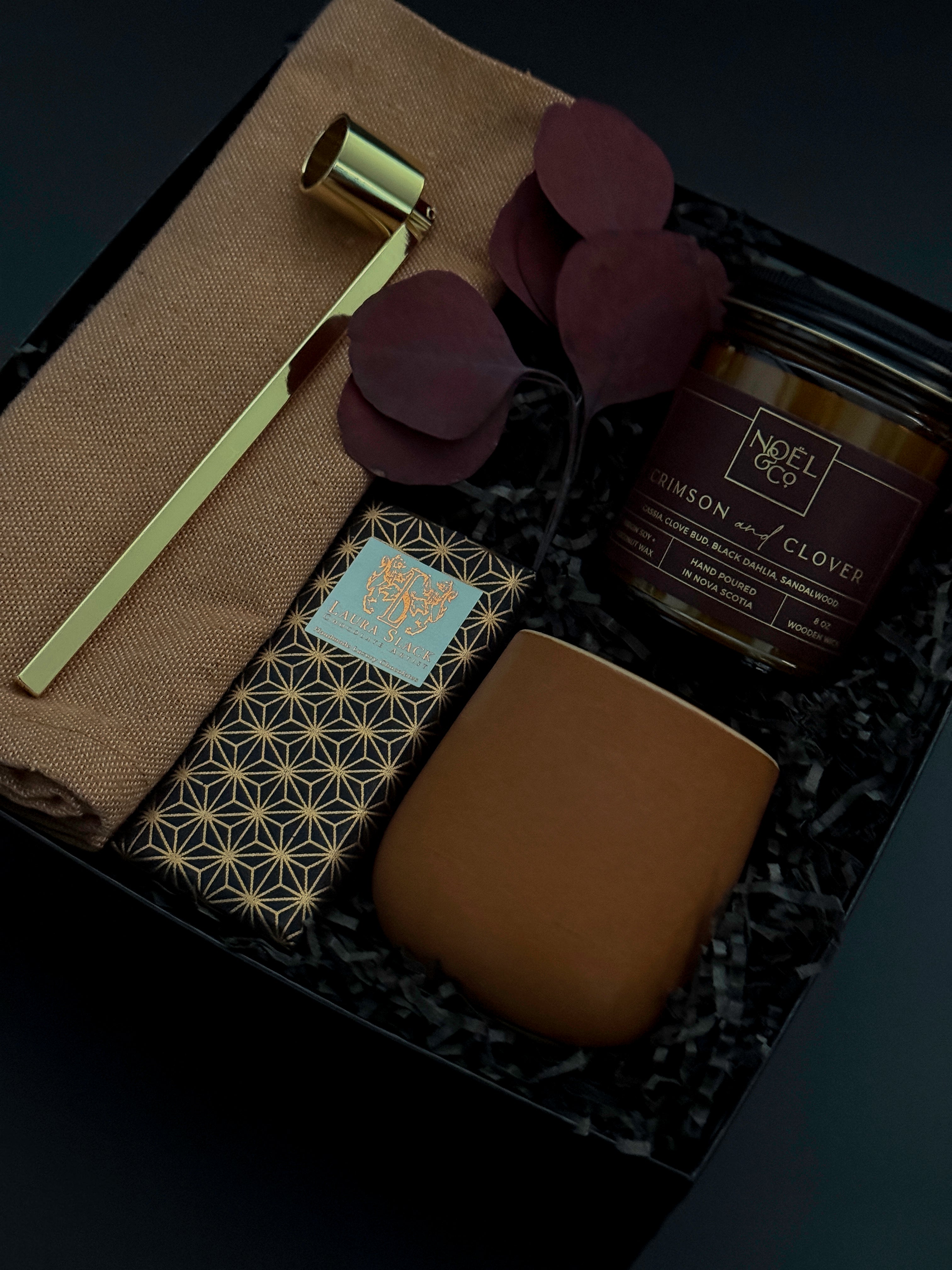 Corporate holiday gift box featuring candle, Japanese Chiyogami chocolate, and gold candle snuffer.
