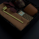 Holiday gift box with Crimson and Clover candle, terracotta cup, and artisan chocolate.
