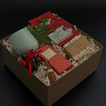 Cinnamon Grove holiday gift box with apple cinnamon tea, artisan chocolate, and festive accents.