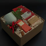 Cinnamon Grove holiday gift box with apple cinnamon tea, artisan chocolate, and festive accents.