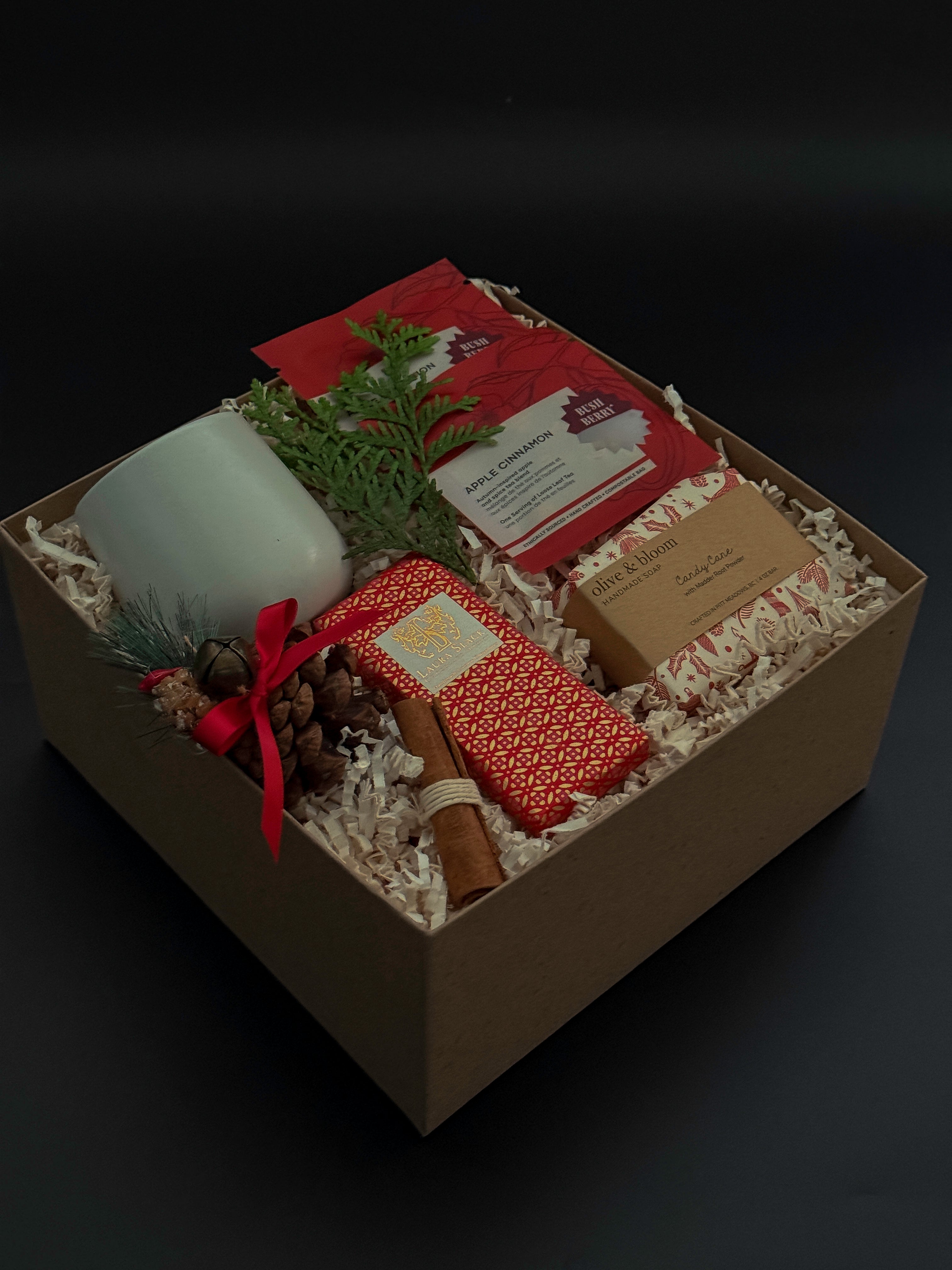 Cinnamon Grove holiday gift box with apple cinnamon tea, artisan chocolate, and festive accents.