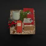 Client appreciation gift box featuring apple cinnamon tea, chocolate bar, and seasonal details.