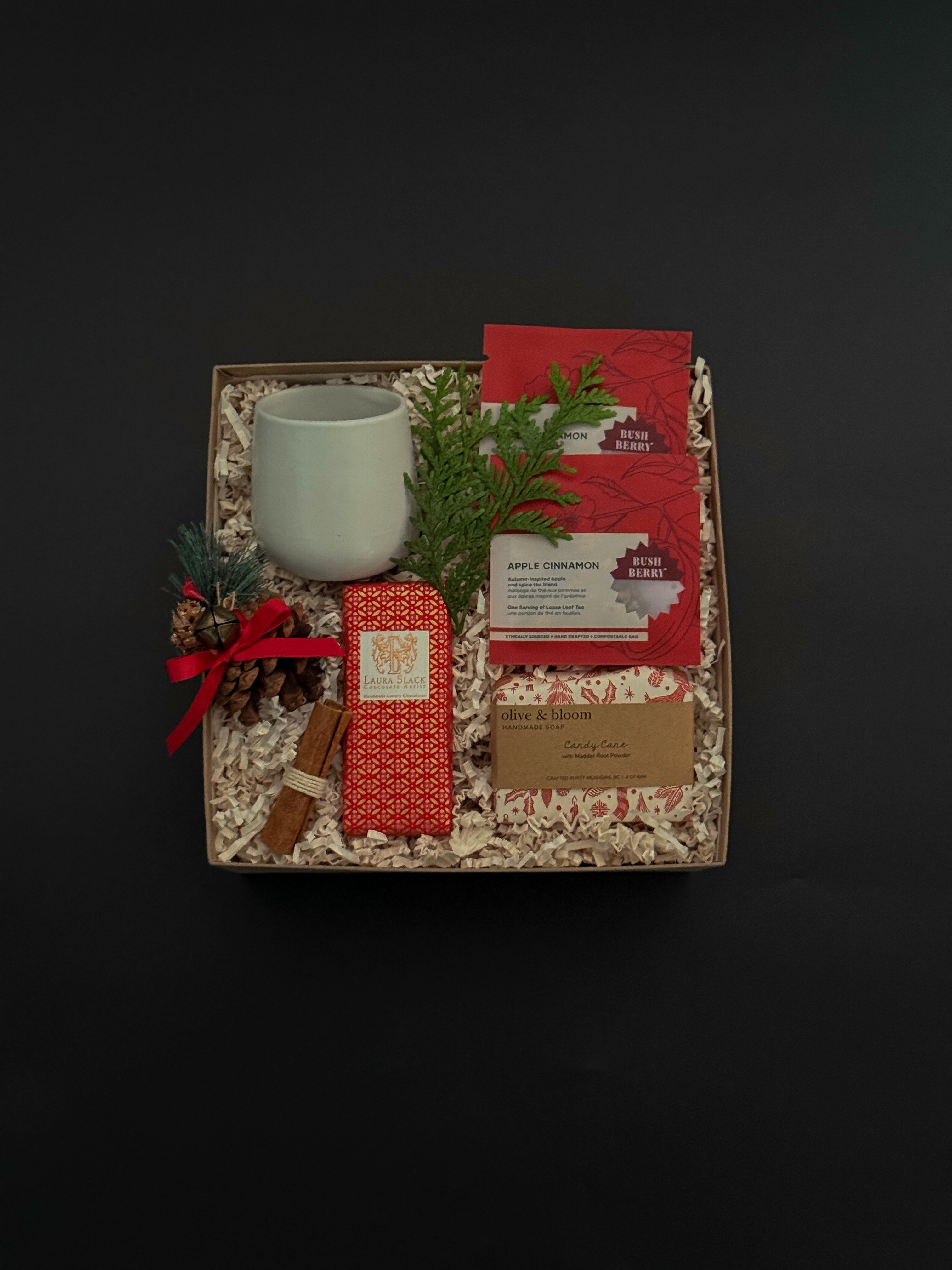 Client appreciation gift box featuring apple cinnamon tea, chocolate bar, and seasonal details.