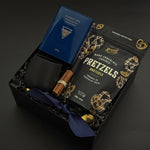 Flat lay of the Midnight Cocoa Gift Box featuring rich drinking chocolate, modern stoneware, and golden details, a luxurious take on a cozy winter ritual.