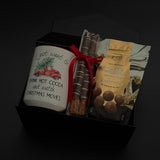 Corporate holiday gift box featuring a hot chocolate mug, chocolate truffles, and pretzels.