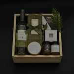 Elegant holiday wine gift box with Mission Hill Sauvignon Blanc, Brie, artisan preserves, chocolate, and charcuterie essentials. Perfect for corporate and client gifting.