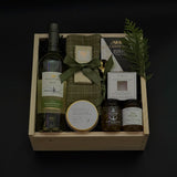 Elegant holiday wine gift box with Mission Hill Sauvignon Blanc, Brie, artisan preserves, chocolate, and charcuterie essentials. Perfect for corporate and client gifting.