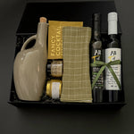 Corporate gourmet gift box with olive oil, balsamic vinegar, almonds, and honey.
