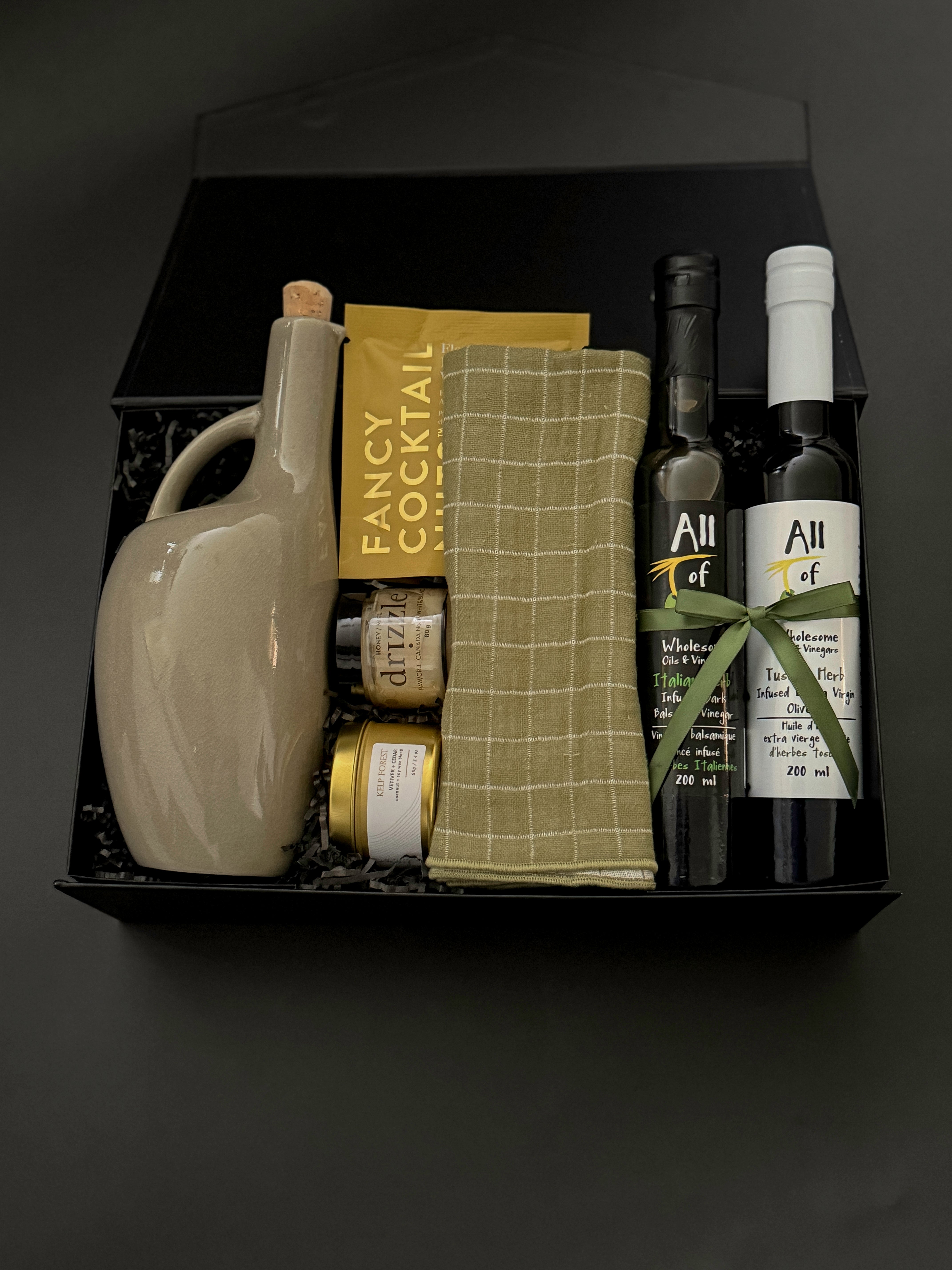 Corporate gourmet gift box with olive oil, balsamic vinegar, almonds, and honey.