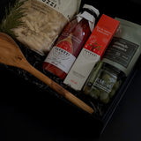 Olive wood spoon and Castelvetrano olives displayed beside the gift box — highlighting the elegant details and craftsmanship.