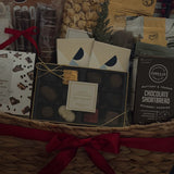 Holiday office share gift basket with chocolate, popcorn, and cookies.