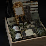 Elegant wood gift box from Muse Baskets and Co. wrapped with grosgrain ribbon and a handwritten notecard — refined packaging detail of The Opulent Collection luxury gift box