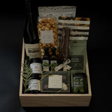 The Opulent Collection by Muse Baskets and Co. — luxury gift box featuring fine Chardonnay, artisan Canadian savouries, gourmet confections, and premium pantry essentials, elegantly arranged in a signature wood box.