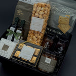 Luxury client closing and housewarming gift basket with Laurel Leaf & Olive candle, artisan preserves, and Canadian-made treats.