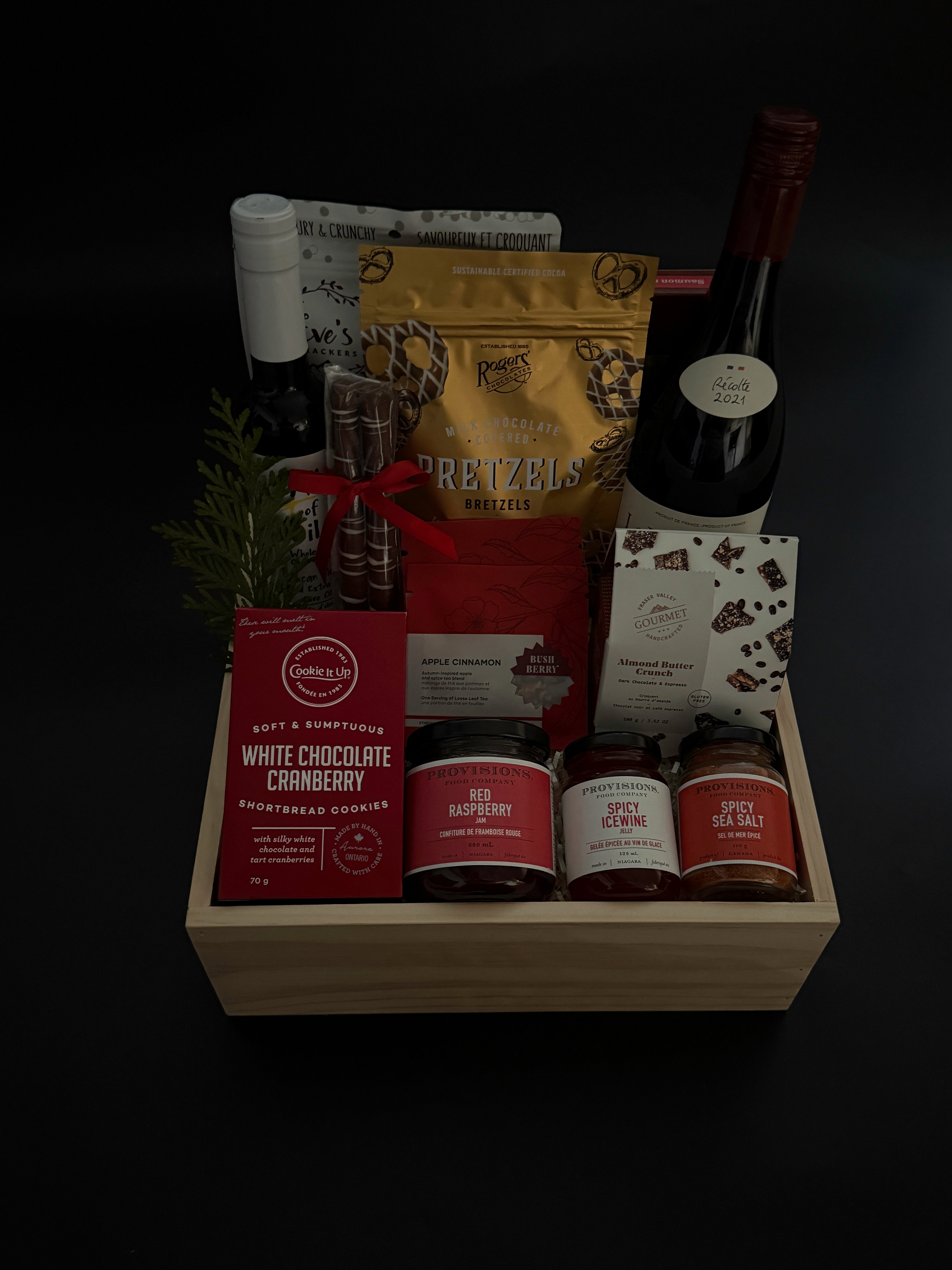 Luxury holiday gift box with French wine, savoury artisan foods, and gourmet confections.