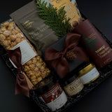 Sweet and savoury corporate gift box with chocolate truffles, brie, caramel popcorn, and honey.