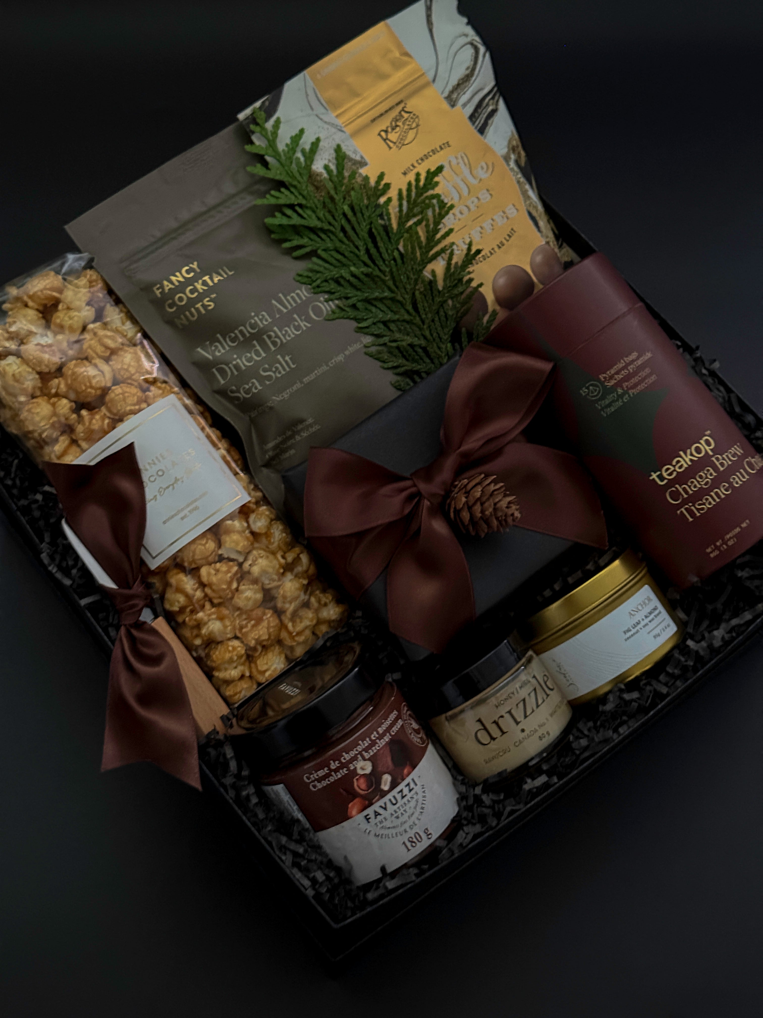 Sweet and savoury corporate gift box with chocolate truffles, brie, caramel popcorn, and honey.
