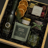 Corporate wine gift box with Kim Crawford Sauvignon Blanc, artisan foods, and festive accents.