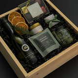 Curated gourmet gift box featuring Sauvignon Blanc, chocolates, almonds, and holiday details.