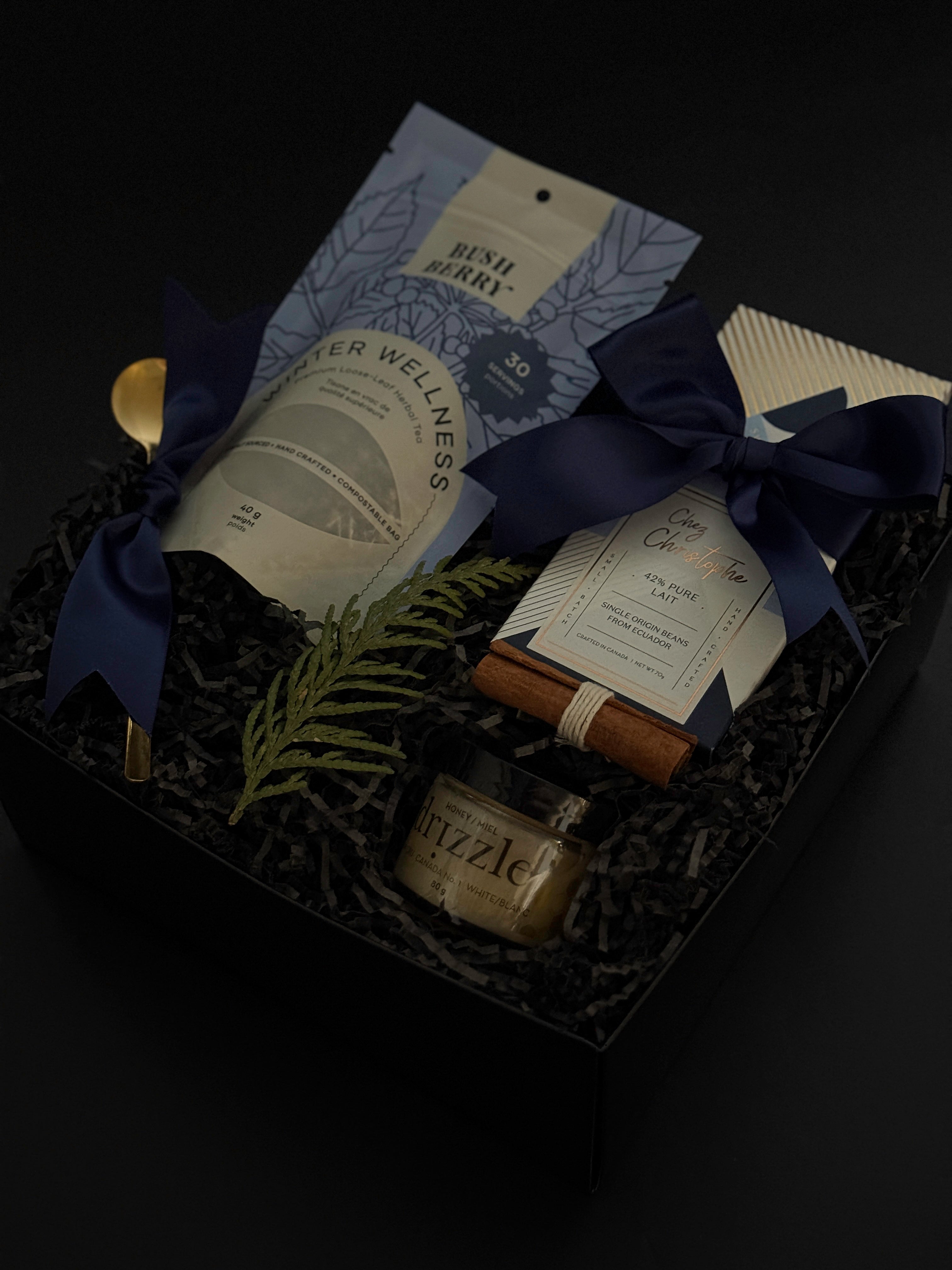 Luxury winter wellness gift box for corporate, client, and holiday gifting featuring artisan tea, chocolate, and seasonal details.