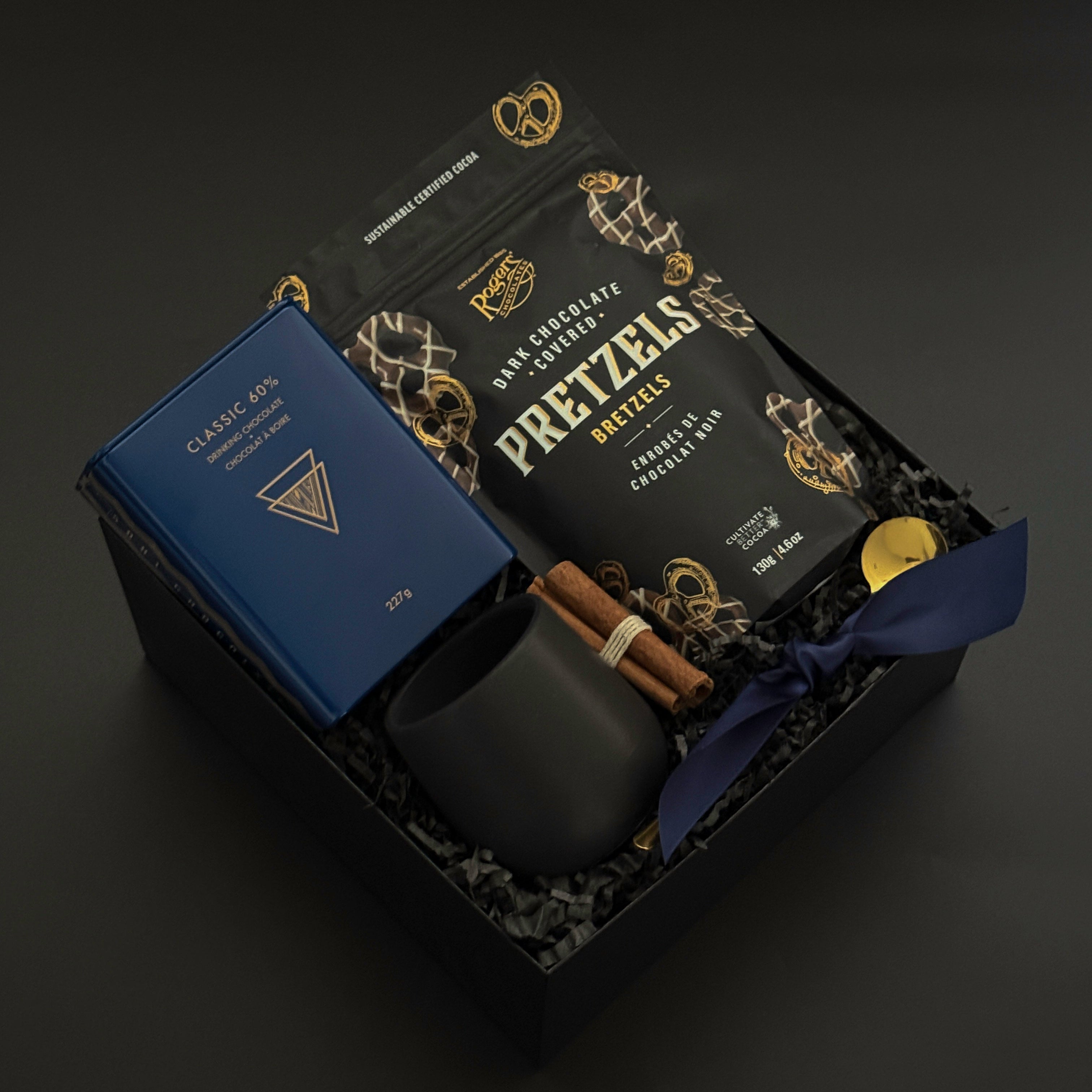 Luxury holiday gift boxes elegantly wrapped with grosgrain ribbon and artisan Canadian products | Muse Baskets and Co.