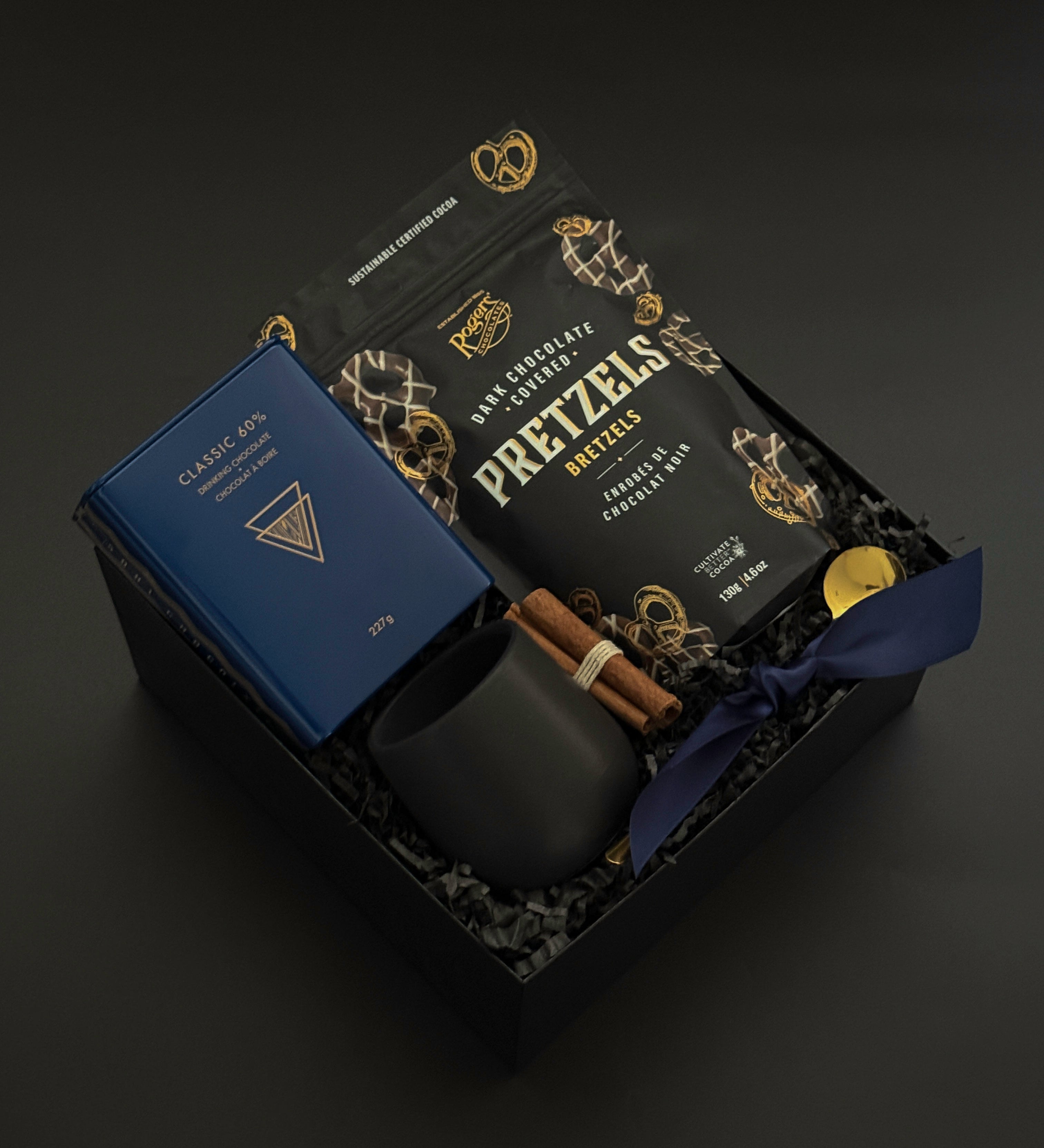 Luxury holiday gift boxes elegantly wrapped with grosgrain ribbon and artisan Canadian products | Muse Baskets and Co.