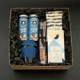 The Reset wellness gift box for men featuring protein lattes, cashews, chocolate, pretzel rods, and reusable travel cup – Muse Baskets & Co.