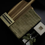 Luxury realtor closing gift box by Muse Baskets and Co. with Aēsop soap, acacia board, tea towel, olive oil and balsamic vinegar for a new homeowner.