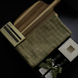 Luxury realtor closing gift box by Muse Baskets and Co. with Aēsop soap, acacia board, tea towel, olive oil and balsamic vinegar for a new homeowner.