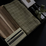 Hestia possession day gift box in black packaging with home and kitchen pieces, including Aēsop soap, acacia wood board, olive oil and balsamic vinegar.