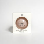 Aqua Studio Butter Bomb Bath Bomb packaging box, a self-care product featured in Muse Baskets and Co. gift baskets