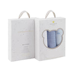 Three baby blankets in white, blue, and gray in a gift box set