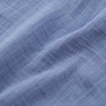 Close-up of blue swaddle with a subtle pattern