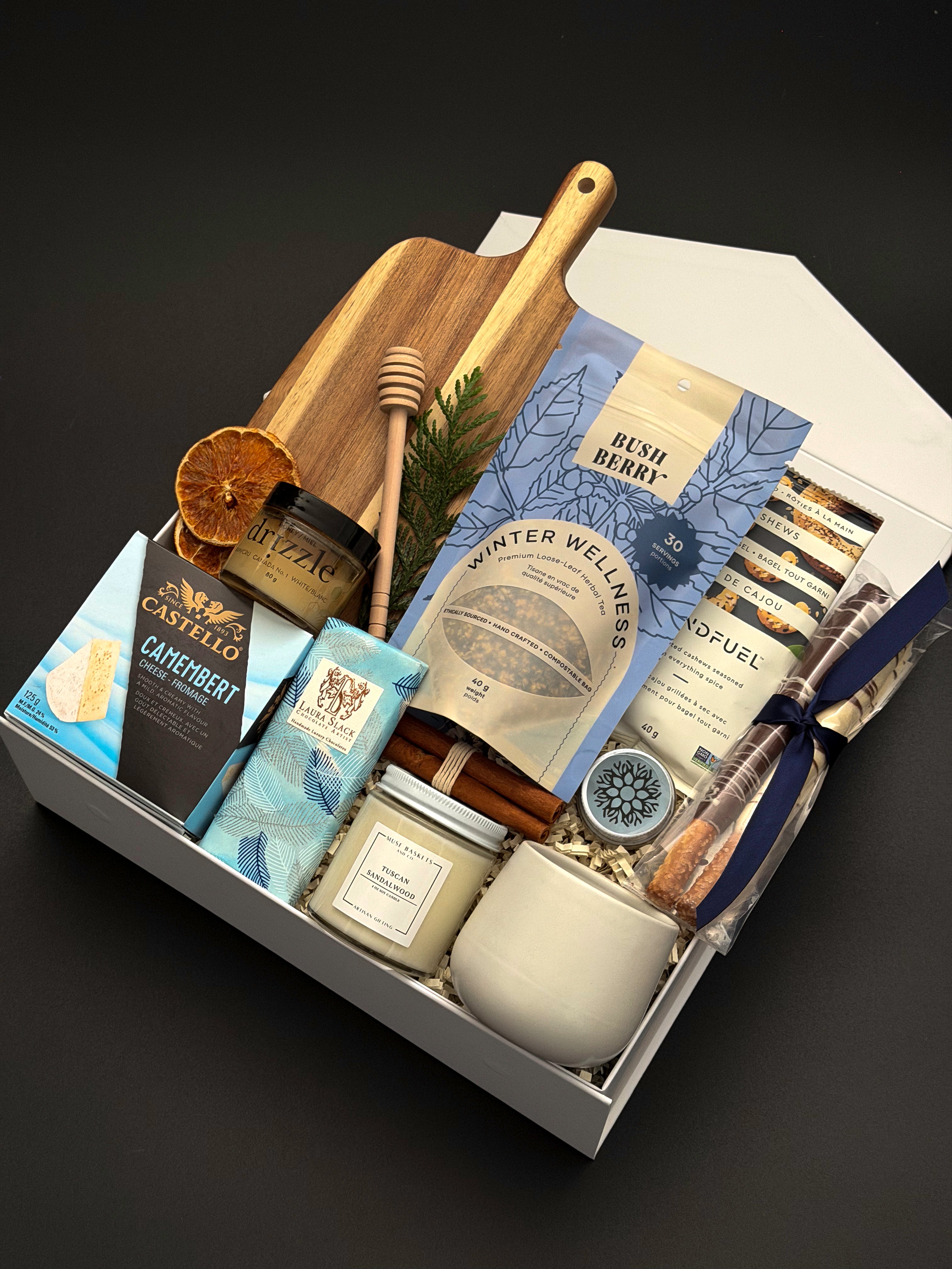 Fireside Provisions client appreciation gift by Muse Baskets and Co., with a soy candle, stoneware tea cup and chocolate in a Signature Pearl White gift box.