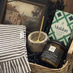 Woven housewarming gift basket with Canadian-made home accents, acacia serving board, Maldon salt, marble salt cellar and Hearth & Home candle by Muse Baskets and Co.