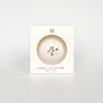 Chamomile and Oat Bath Bomb packaging box, a self-care product featured in Muse Baskets and Co. gift baskets