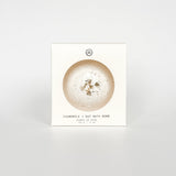Chamomile and Oat Bath Bomb packaging box, a self-care product featured in Muse Baskets and Co. gift baskets